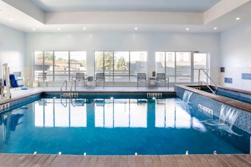 a swimming pool with blue water in a house at TownePlace Suites Amarillo West/Medical Center in Amarillo