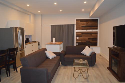 a living room with a couch and a table at Cozy Retreat Near Westport in Fairfield