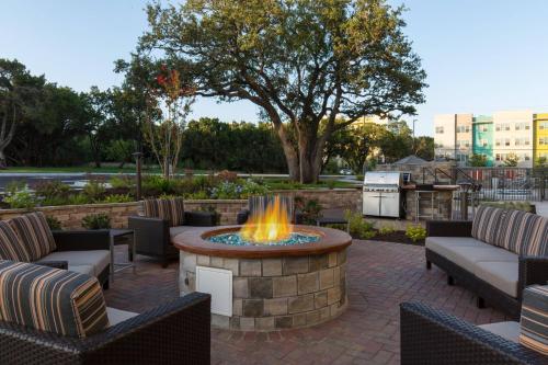 a fire pit in a patio with chairs and a table at Towneplace Suites By Marriott Austin North/Lakeline in Cedar Park
