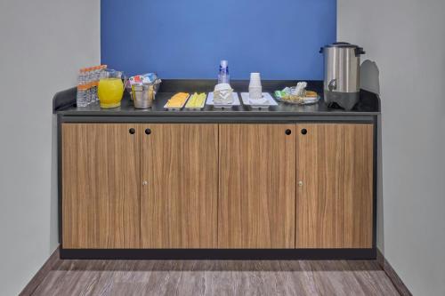 a counter in a room with aperature at City Express by Marriott Mexicali in Mexicali