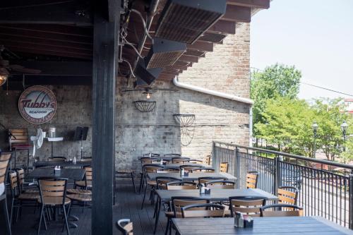 a row of tables and chairs on a patio at River Street Inn in Savannah