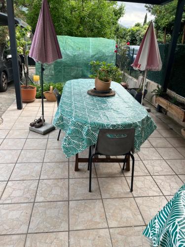 a table with a table cloth on a patio at Villa 2 chambres piscine municipale à 500 m in Arles-sur-Tech