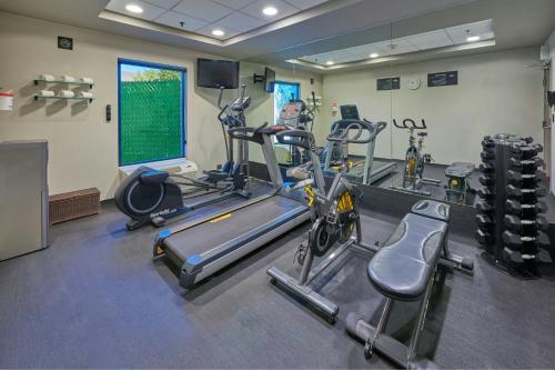 a gym with several tread machines in a room at City Express by Marriott Celaya Galerias in Celaya