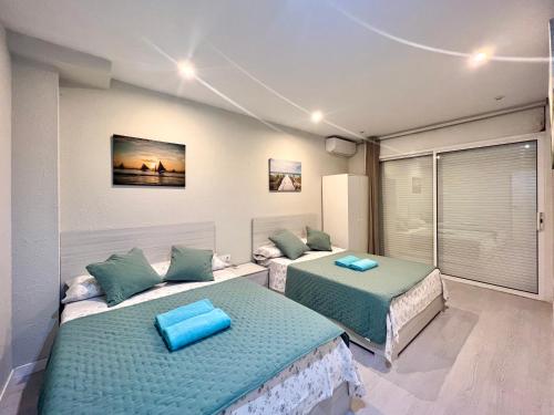 Postel nebo postele na pokoji v ubytování Apartamentos Playa