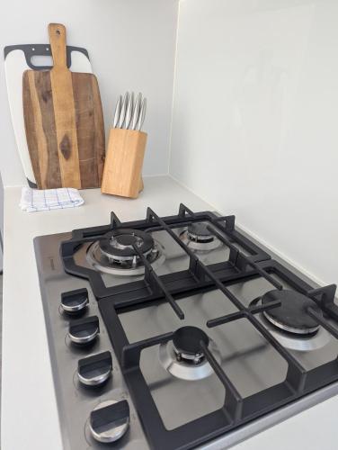 a stove top oven sitting on top of a counter at 2 bedroom apartment with Garden views in Sydney in Sydney