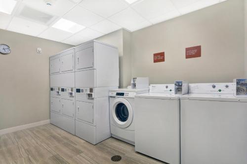 a laundry room with a washer and dryer at TownePlace Suites by Marriott Jackson Airport/Flowood in Flowood