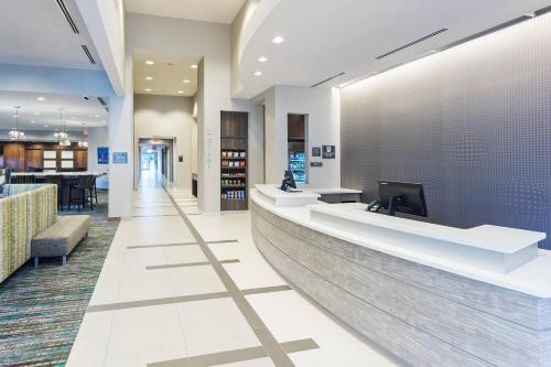 a lobby of a hospital with a reception counter at Residence Inn by Marriott Houston West/Beltway 8 at Clay Road in Houston