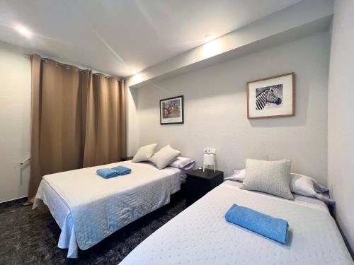Postel nebo postele na pokoji v ubytování Apartamentos Playa