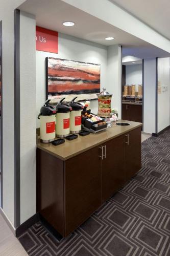 an office lobby with a counter with pots and pans at TownePlace Suites by Marriott Springfield in Springfield