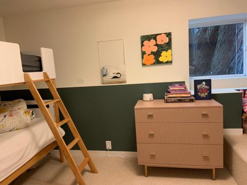 a bedroom with a bunk bed and a dresser at Historic house, surrounded by nature with a hot tub in San Francisco