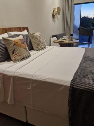 Ένα ή περισσότερα κρεβάτια σε δωμάτιο στο Residencial Mirante
