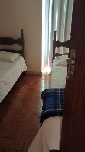 Ein Bett oder Betten in einem Zimmer der Unterkunft Hotel Faria reserva