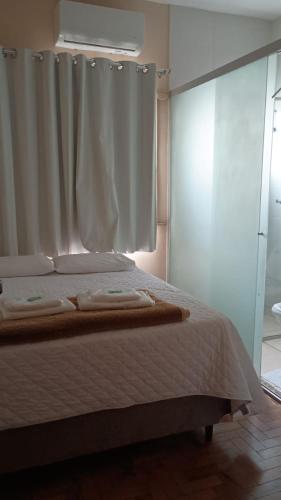 Ein Bett oder Betten in einem Zimmer der Unterkunft Hotel Faria reserva