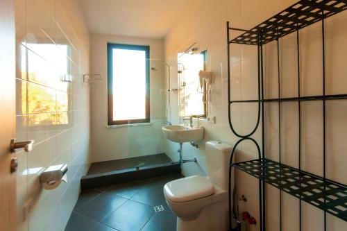 a bathroom with a toilet and a sink at Vardzia Resort in Vardzia