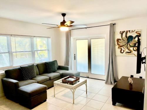 a living room with a couch and a table at The Seagate in The Bight Settlements