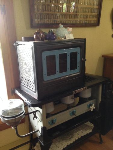 a tv sitting on a table in a room at L'Aubergine in Saint Hilarion