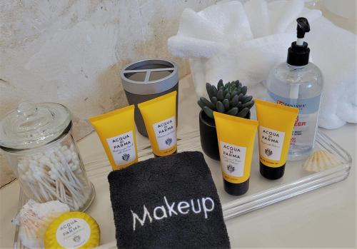 a table with a tray of makeup products on it at Long Bay View Villa in Leeward