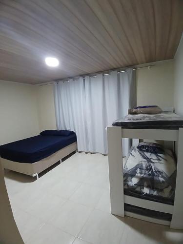 Katil atau katil-katil dalam bilik di Rosemary Hospedagem
