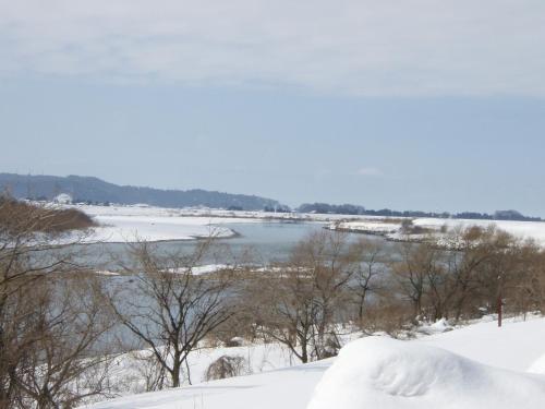 a view of a river in the snow at Itoya Ryokan in Nanyo