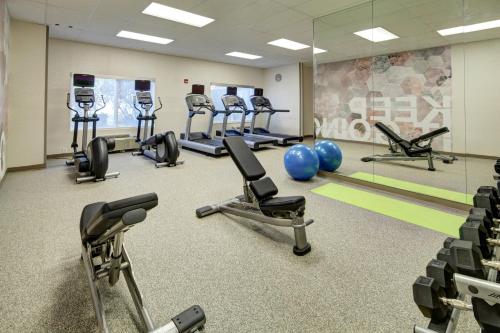 a gym with several exercise bikes and exercise balls at SpringHill Suites Port Saint Lucie in Port Saint Lucie