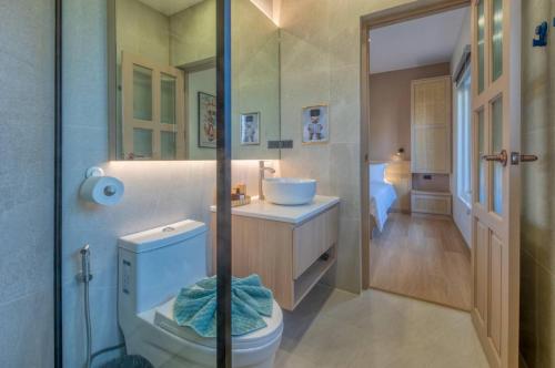 a bathroom with a toilet and a sink and a shower at Thirty Degrees in February, Khao Tao, Hua Hin in Khao Tao