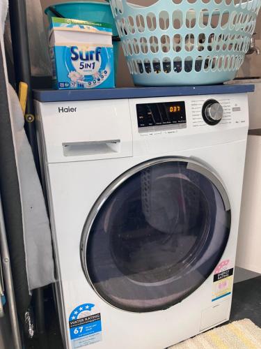 a washing machine with a basket on top of it at City oasis in Gisborne