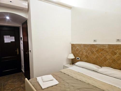 Postel nebo postele na pokoji v ubytování Check in Rome