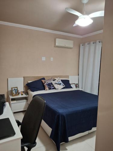 En eller flere senge i et værelse på Espaço de descanso e paz