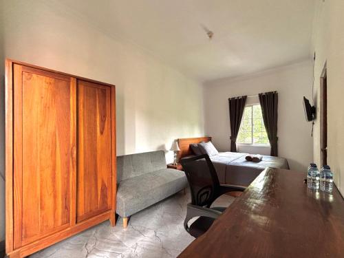 Ένα ή περισσότερα κρεβάτια σε δωμάτιο στο Jingga Guesthouse