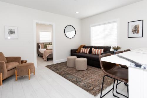 a living room with a couch and a table at Inn At Fulton Boutique Hotel in Sandusky