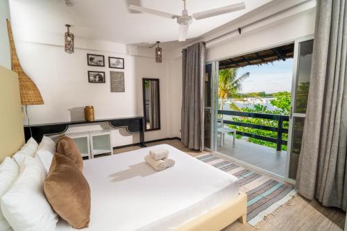 Postel nebo postele na pokoji v ubytování Blanco Beach Resort Malapascua