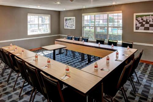 a large conference room with a long table and chairs at TownePlace Suites Dallas Las Colinas in Irving