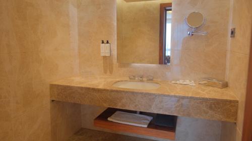 a bathroom with a sink and a mirror at Crowne Plaza Kayseri by IHG in Kayseri