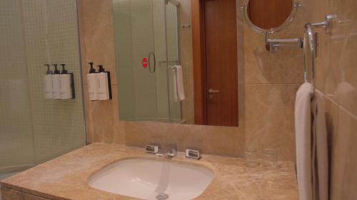 a bathroom with a sink and a mirror at Crowne Plaza Kayseri by IHG in Kayseri