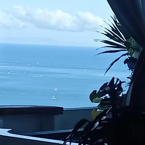 a view of the ocean with a boat in the water at Rara Villas Lombok in Senggigi 
