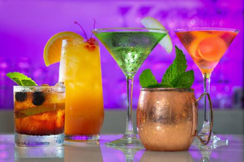 a group of three cocktails sitting on a table at Le Meridien Dallas by the Galleria in Dallas