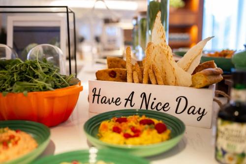 a sign that reads have a nice day with french fries at London Heathrow Marriott Hotel in Hillingdon