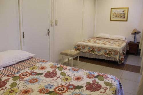 a room with two beds and a room with two beds at Stefanich Aparthotel 2122 in Ciudad del Este