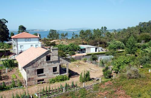 an old house on top of a hill at Hotel Ria Toxa in Revolta