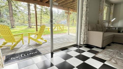 a living room with a couch and a table and chairs at Family friendly house with MIL suite in Sammamish