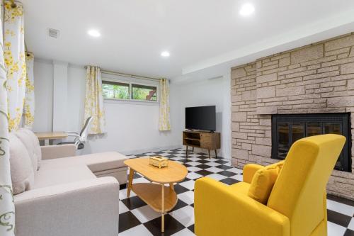 a living room with a couch and a fireplace at Family friendly house with MIL suite in Sammamish