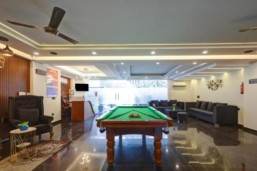 a lobby with a pool table in a room at Royal Residency - Medanta in Gurgaon