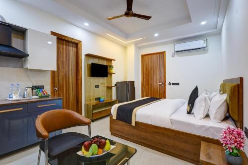 a hotel room with a bed and a kitchen at Royal Residency - Medanta in Gurgaon