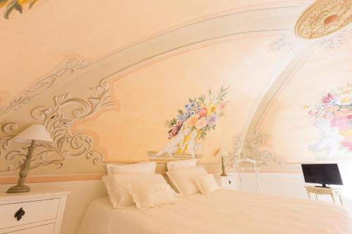 Säng eller sängar i ett rum på Suite Le Perle