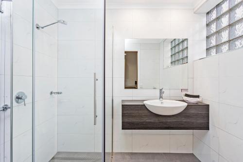 a bathroom with a sink and a shower at Comfort Inn Lady Augusta in Swan Hill