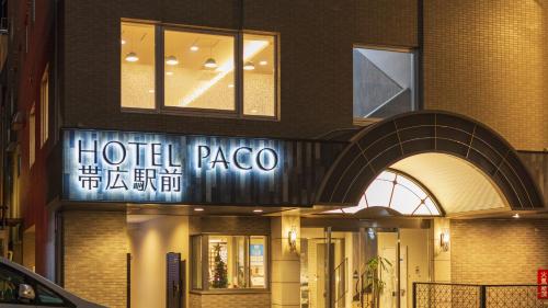a hotel pasco sign on the side of a building at Hotel Paco Obihiro Ekimae in Obihiro