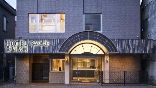 a hotel papago building with a sign that reads hotelzona at Hotel Paco Obihiro Ekimae in Obihiro