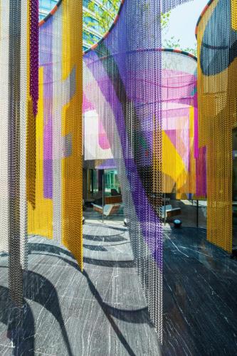 a view through a mesh window of a street at W Shanghai - The Bund in Shanghai