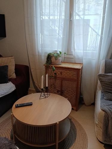 a living room with a coffee table and a couch at Ammoudara Apartment's in Kalymnos