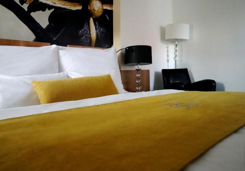 Ένα ή περισσότερα κρεβάτια σε δωμάτιο στο Boutique Hotel Golf Garni
